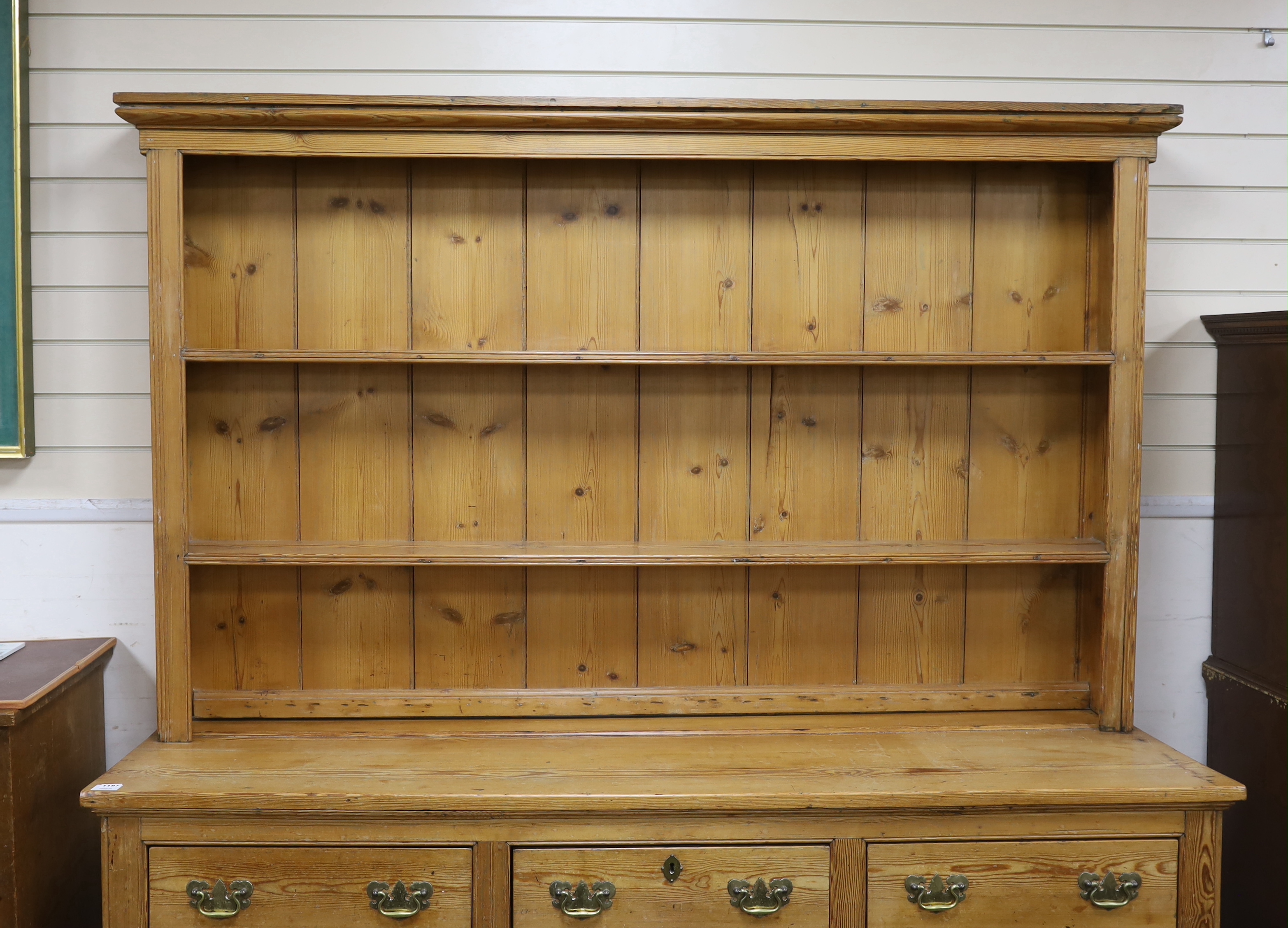 A Victorian pine dresser with boarded rack, width 181cm, depth 51cm, height 206cm
